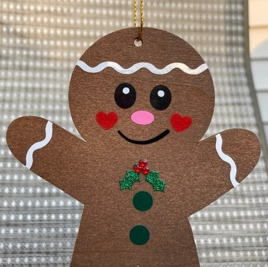 Wooden Gingerbread Christmas Ornaments, boy close up
