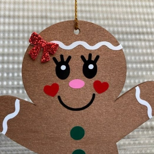 Wooden Gingerbread Christmas Ornaments, girl close up